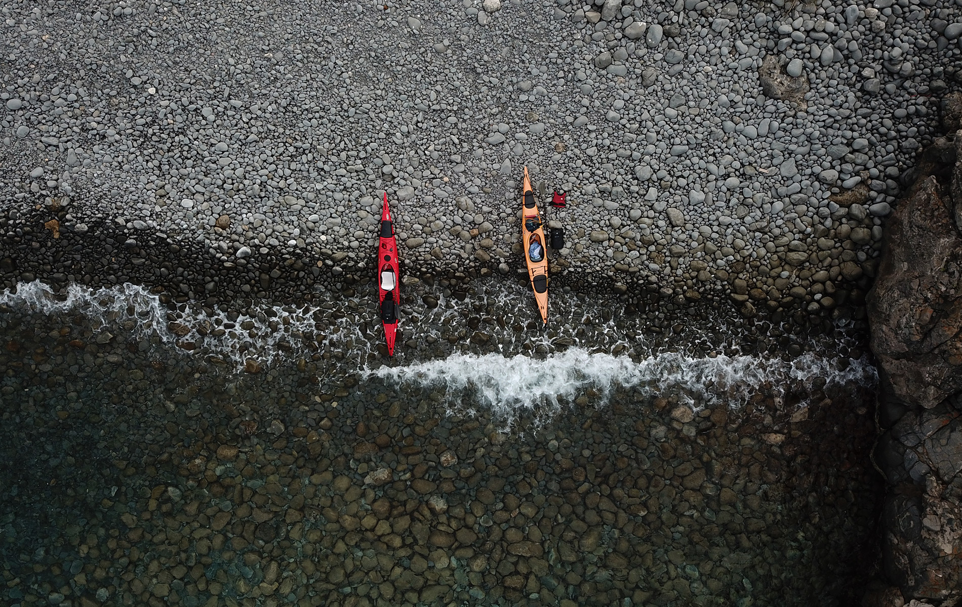 Paddling to the Middle of the Adriatic Sea II. – Brusnik Volcano and Biševo Sea Caves 7 sea kayaks parked on the beach